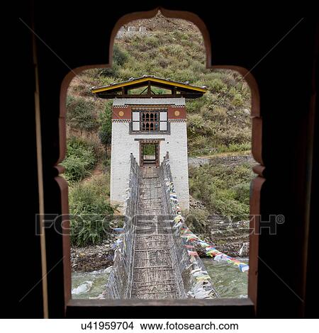 Picture - Iron Suspension Bridge in Tamchhog Lhakhang, Bhutan. Fotosearch