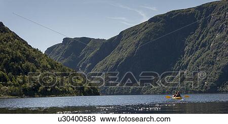 Stock Image - Kayaking in Gros Morne National Park, Trout River Pond, Newfoundland and Labrador, Canada. Fotosearch