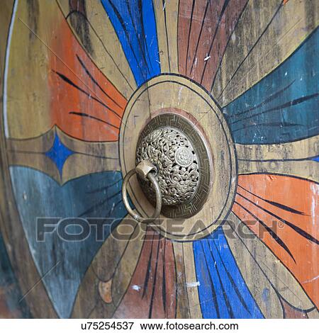Stock Photo - Knocker on a door at the Trongsa Dzong fortress. Fotosearch