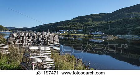 Stock Image - Lobster traps at fishing dock, Trout River, Southeast Brook Falls, Gros Morne National Park, Newfoundland and Labrador, Canada. Fotosearch