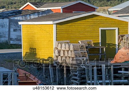 Stock Image - Lobster traps at fishing dock, Trout River, Southeast Brook Falls, Gros Morne National Park, Newfoundland and Labrador, Canada. Fotosearch