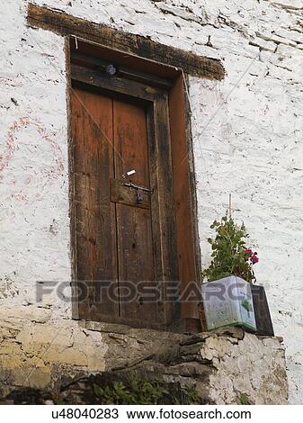 Low angle view of a door of a house, Bhutan View Large Photo Image Stock Image - Low angle view of a door of a house, Bhutan. Fotosearch