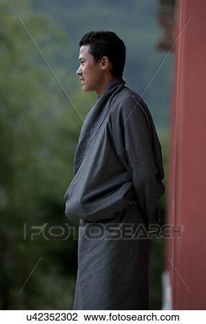 Stock Image - Man at Kharchung Goemba, Chokhor Valley, Bumthang District, Bhutan. Fotosearch