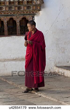 Stock Photo - Monk at Wangdue Dzong, Wangdue Phodrang, Bhutan. Fotosearch