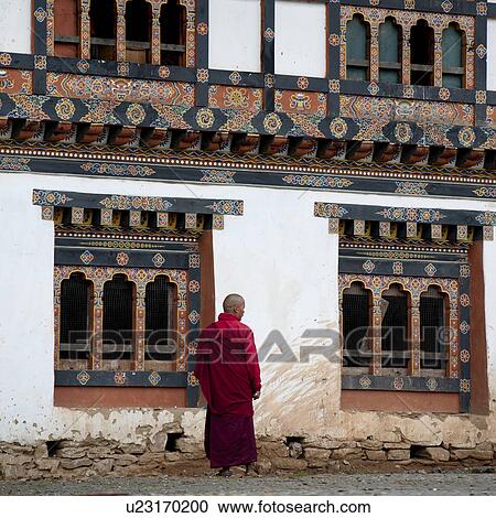 Stock Image - Monk outside the Gangte Goemba Monastery, Phobjikha Valley. Fotosearch