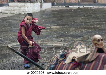 Monk practicing martial arts at Trongsa Dzong, Trongsa, Bhutan View Large Photo Image Stock Image - Monk practicing martial arts at Trongsa Dzong, Trongsa, Bhutan. Fotosearch