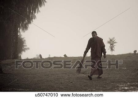 Monk walking with a broom at Talo Monastery, Punakha Valley, Punakha District, Bhutan View Large Photo Image Stock Image - Monk walking with a broom at Talo Monastery, Punakha Valley, Punakha District, Bhutan. Fotosearch