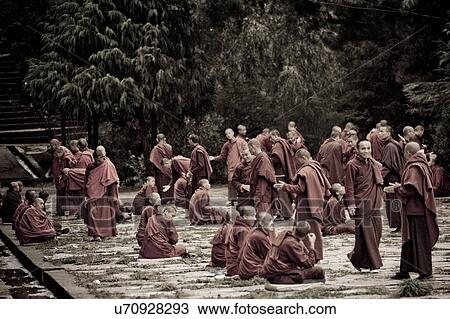 Stock Image - Monks debating at Kharchung Goemba, Chokhor Valley, Bumthang District, Bhutan. Fotosearch