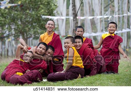 Monks in a field at Chimi Lhakhang, Punakha District, Bhutan View Large Photo Image Stock Image - Monks in a field at Chimi Lhakhang, Punakha District, Bhutan. Fotosearch