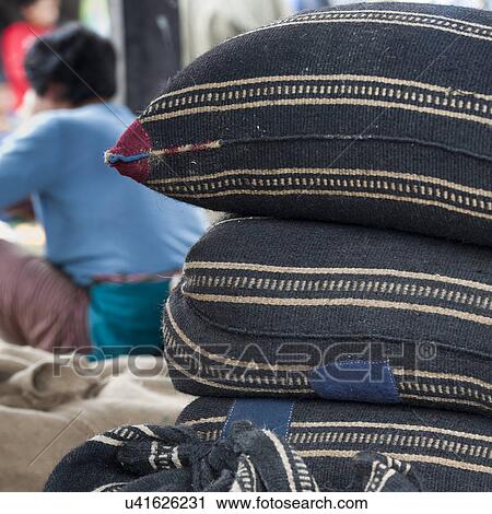Stock Image - Pile of cushions in open market, Khuruthang town, Punakha District. Fotosearch