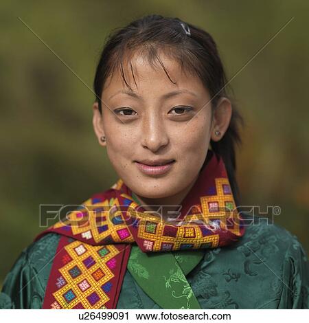Stock Image - Portrait of a woman smiling, Chokhor Valley, Bumthang District, Bhutan. Fotosearch