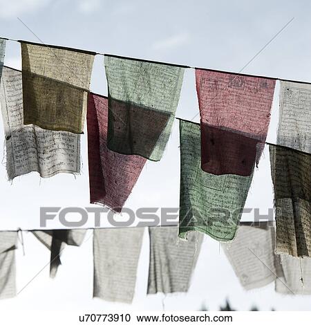 Prayer flags hanging on a line in the city of Thimphu, Bhutan, Asia View Large Photo Image Stock Image - Prayer flags hanging on a line in the city of Thimphu, Bhutan, Asia. Fotosearch