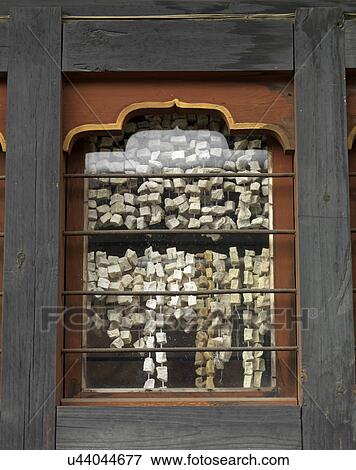 Prayer tags viewed from a window glass, Chokhor Town, Bumthang District, Bhutan View Large Photo Image Stock Photo - Prayer tags viewed from a window glass, Chokhor Town, Bumthang District, Bhutan. Fotosearch