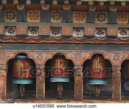 Stock Image - Prayer wheels at Kyichu Lhakhang, Lamgong Gewog, Paro Valley, Paro District, Bhutan. Fotosearch