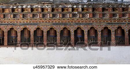 Prayer wheels at the temple in Wangdue Phodrang Dzong, Wangdue Phodrang, Bhutan View Large Photo Image Stock Photo - Prayer wheels at the temple in Wangdue Phodrang Dzong, Wangdue Phodrang, Bhutan. Fotosearch