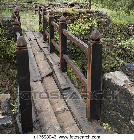 Stock Image - Ruins of a footbridge at Zurig Dzong, Paro Valley, Paro District, Bhutan. Fotosearch