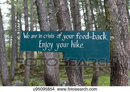 Picture - Signboard on a tree at Taktsang Monastery, Paro Valley, Paro District, Bhutan. Fotosearch