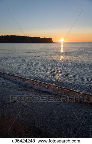 Sunset on the beach, Trout River, Gros Morne National Park, Newfoundland and Labrador, Canada View Large Photo Image Stock Photo - Sunset on the beach, Trout River, Gros Morne National Park, Newfoundland and Labrador, Canada. Fotosearch