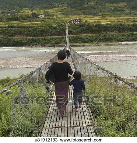 Suspension bridge across the Puna Tsang River, Punakha District, Bhutan View Large Photo Image Stock Image - Suspension bridge across the Puna Tsang River, Punakha District, Bhutan. Fotosearch