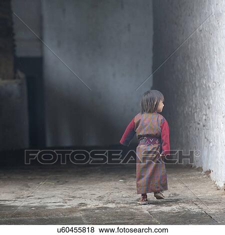 Stock Photo - Toddler at Trongsa Dzong. Fotosearch