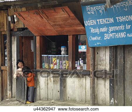 Stock Photo - Two children at a shop, Chokhor Town, Bumthang District, Bhutan. Fotosearch