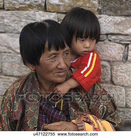 Woman praying with her granddaughter at National Memorial Chorten, Thimphu, Bhutan View Large Photo Image Stock Photography - Woman praying with her granddaughter at National Memorial Chorten, Thimphu, Bhutan. Fotosearch