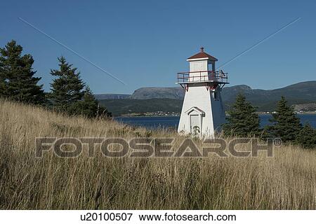 Stock Photo - Woody Point Lighthouse at coast, Southeast Brook Falls, Gros Morne National Park, Newfoundland and Labrador, Canada. Fotosearch