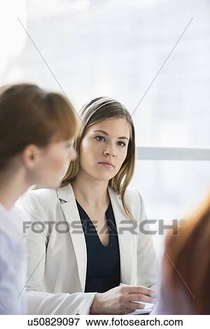 Beautiful businesswoman in meeting at office View Large Photo Image Stock Photo - Beautiful businesswoman in meeting at office. Fotosearch