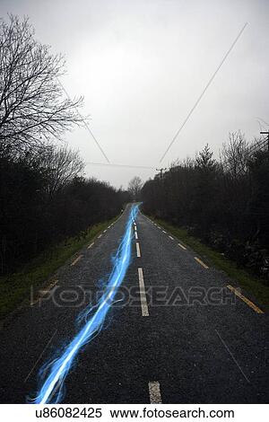 Blue streak of light on country road View Large Photo Image Stock Photography - Blue streak of light on country road. Fotosearch