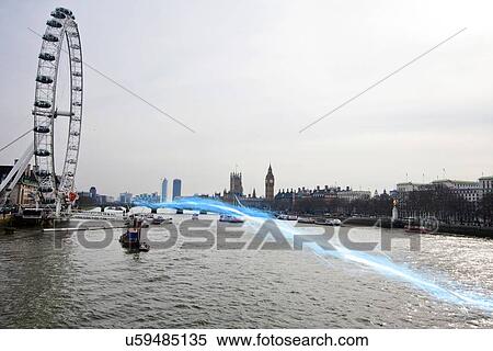 Stock Photography - Blue streak of light passing over river Thames. Fotosearch