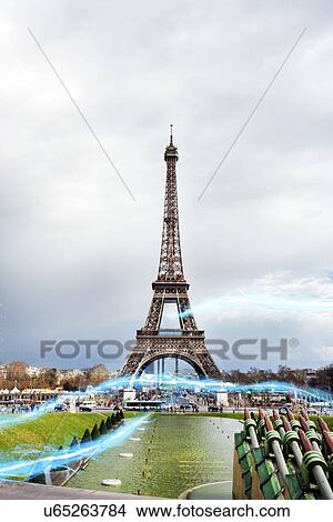 Blue streak of lights against Eiffel Tower View Large Photo Image Picture - Blue streak of lights against Eiffel Tower. Fotosearch