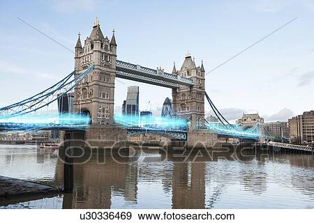 Stock Photo - Blue streak of lights passing through London Bridge. Fotosearch