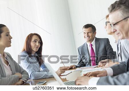 Business people in conference room View Large Photo Image Stock Image - Business people in conference room. Fotosearch