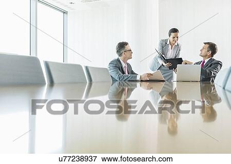 Business people in meeting View Large Photo Image Stock Photo - Business people in meeting. Fotosearch