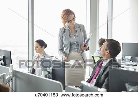 Business people working in an open plan office View Large Photo Image Stock Image - Business people working in an open plan office. Fotosearch