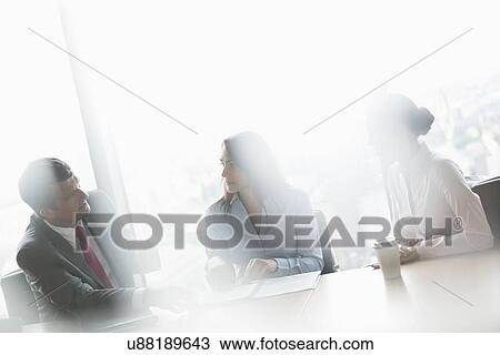 Businessman with female colleagues in conference meeting View Large Photo Image Stock Image - Businessman with female colleagues in conference meeting. Fotosearch