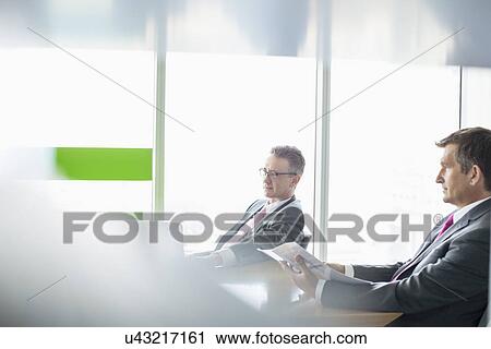 Businessmen working in office View Large Photo Image Stock Image - Businessmen working in office. Fotosearch