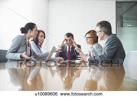 Stock Photograph - Businesspeople arguing in meeting. Fotosearch