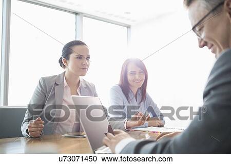 Businesspeople in conference meeting View Large Photo Image Stock Image - Businesspeople in conference meeting. Fotosearch