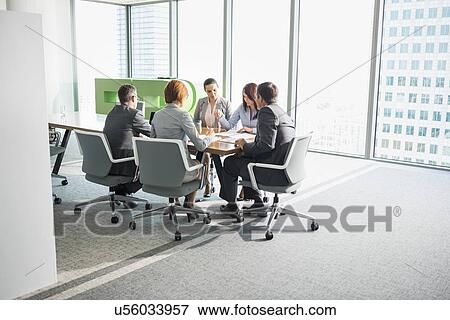 Stock Photo - Businesspeople in conference room. Fotosearch
