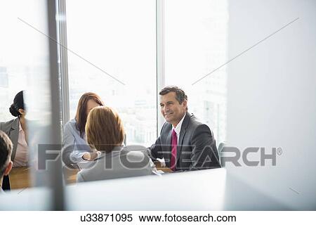 Businesspeople in conference room View Large Photo Image Stock Photography - Businesspeople in conference room. Fotosearch