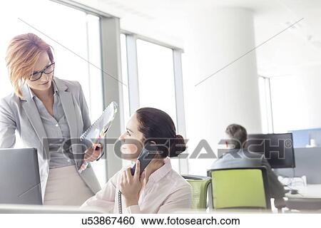 Businesswomen working in office View Large Photo Image Stock Image - Businesswomen working in office. Fotosearch