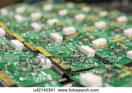 Close-up of circuit board in electronics industry View Large Photo Image Stock Image - Close-up of circuit board in electronics industry. Fotosearch