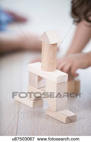 Close-up of wooden tower on hardwood floor View Large Photo Image Stock Photo - Close-up of wooden tower on hardwood floor. Fotosearch