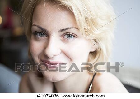 Stock Photograph - Close-up portrait of confident woman in cafe. Fotosearch
