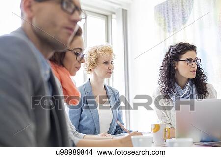 Picture - Creative businesspeople in meeting at office. Fotosearch