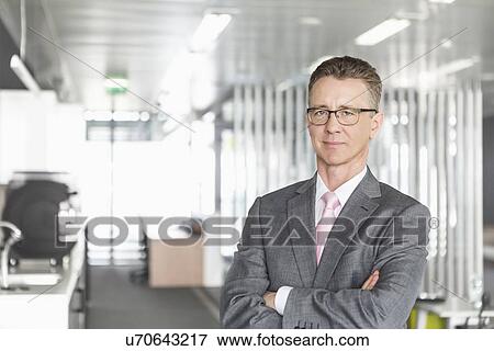 Cropped image of businesswoman using laptop in office View Large Photo Image Stock Photo - Cropped image of businesswoman using laptop in office. Fotosearch