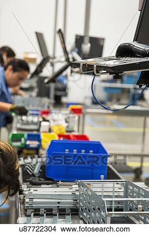 Picture - Cropped image of female engineers working in manufacturing industry. Fotosearch