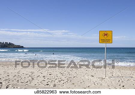 Stock Image - "Dangerous Current" sign on Bondi beach, Sydney, Australia. Fotosearch
