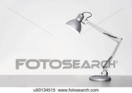 Desk lamp on table over white background View Large Photo Image Stock Photography - Desk lamp on table over white background. Fotosearch